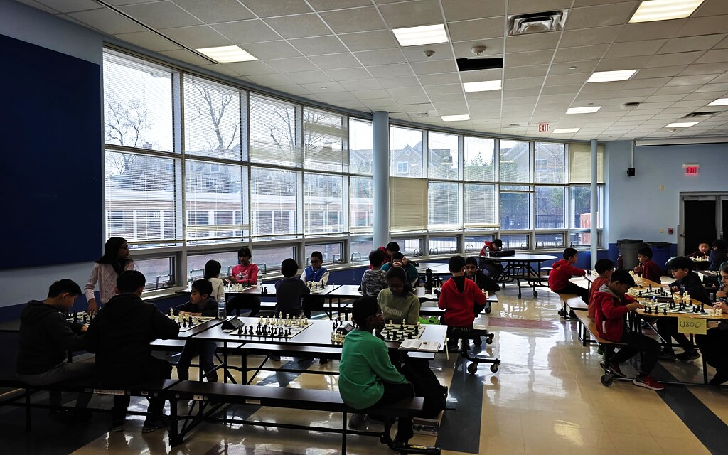Students playing chess during a group class at Chess in Millburn Academy in Millburn, NJ